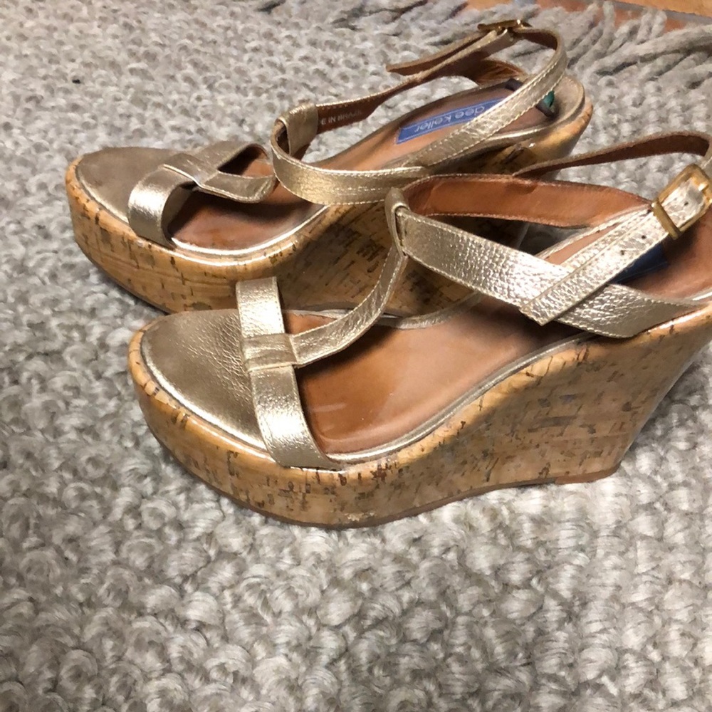 Dee Keller gold wedged heels.
